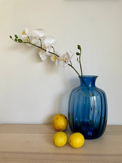 Flowers in Vase and Lemons near