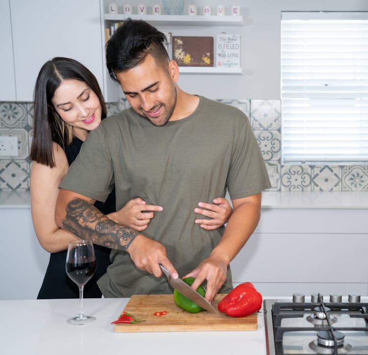 Couple Together In Kitchen