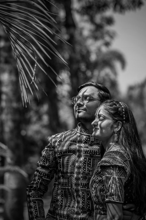 Free Black and white photo of a couple standing together with eyes closed. Stock Photo