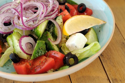 Sliced Cucumber and Tomatoes on White Ceramic Bowl