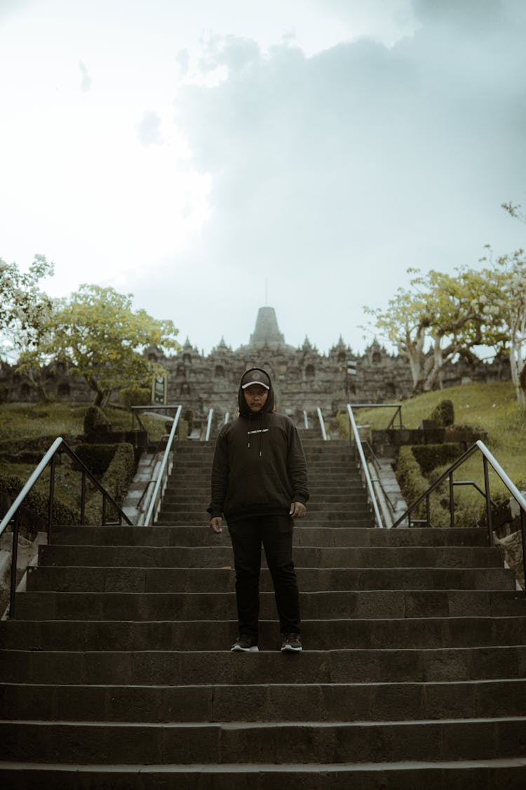 Man In Casual Clothes Standing On Steps