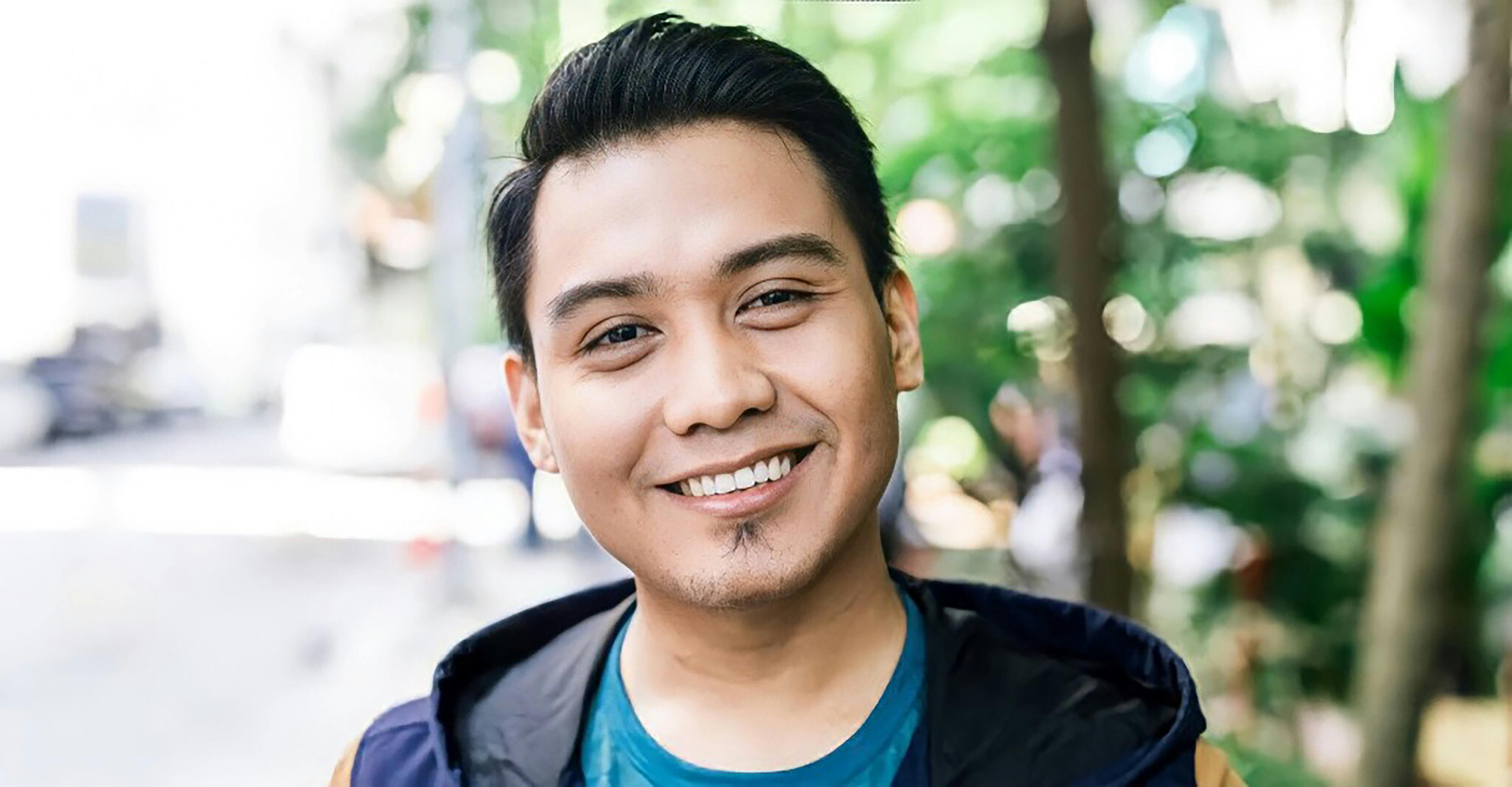 College football stadium under the lights with fans in the stands
