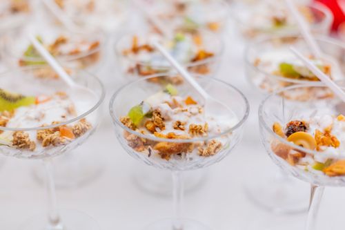 Free Close-up image of yogurt parfaits with granola and fruit served in elegant glassware for breakfast. Stock Photo