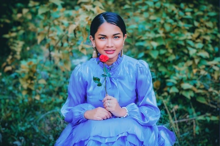 Teenage Girl Holding A Rose