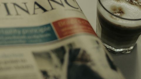A cozy morning scene with coffee and a newspaper in Istanbul, Turkey.