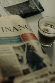 A cozy morning scene with coffee and a newspaper in Istanbul, Turkey.