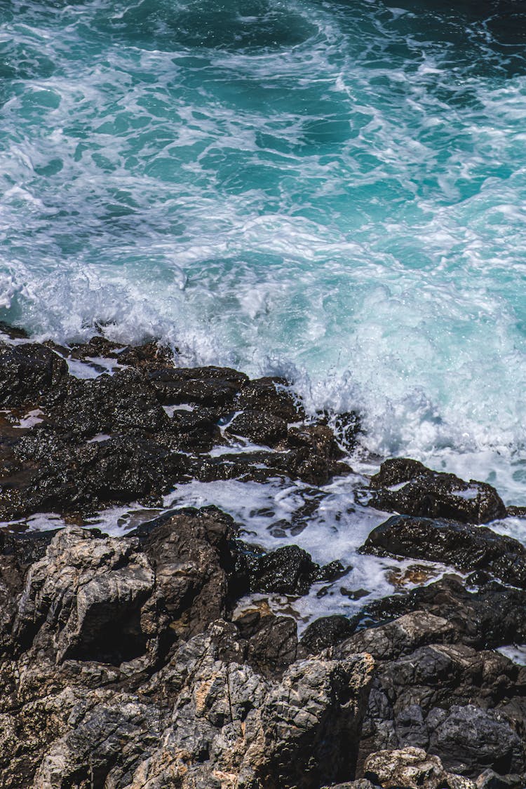 A Sea Waves Crashing On The Rocks 