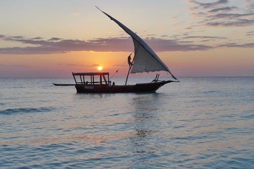 Sailboat at Sea during Sunset