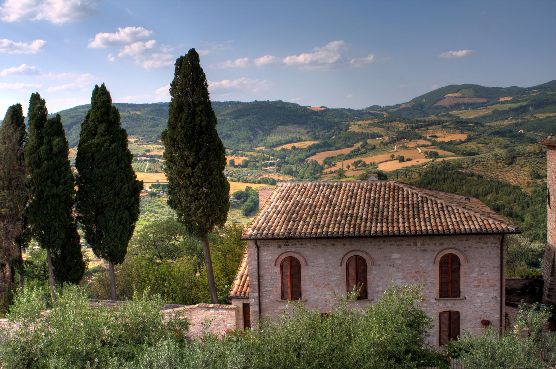 Rolling Umbrian hills and old stone buildings, the sort of landscape guests are trying to take home in object form.