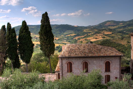 Captivating view of Assisi's rolling hills and traditional architecture in Umbria, Italy.