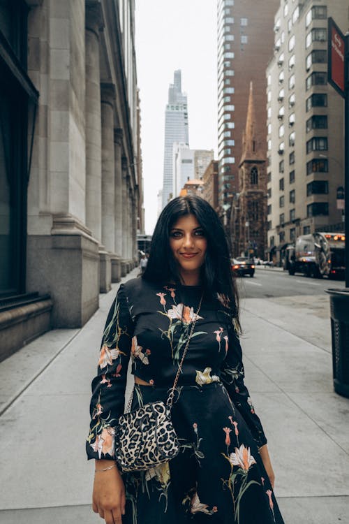 Woman in Dress on Sidewalk in City