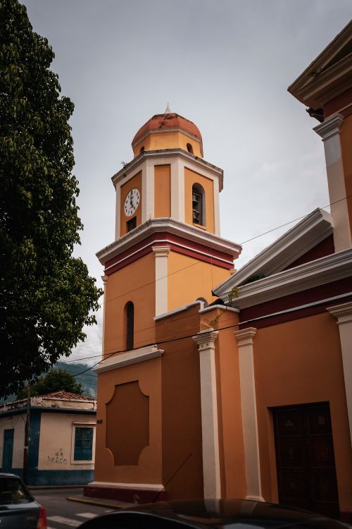 Free A classical colonial church tower with a clock in Mérida, Venezuela. Stock Photo