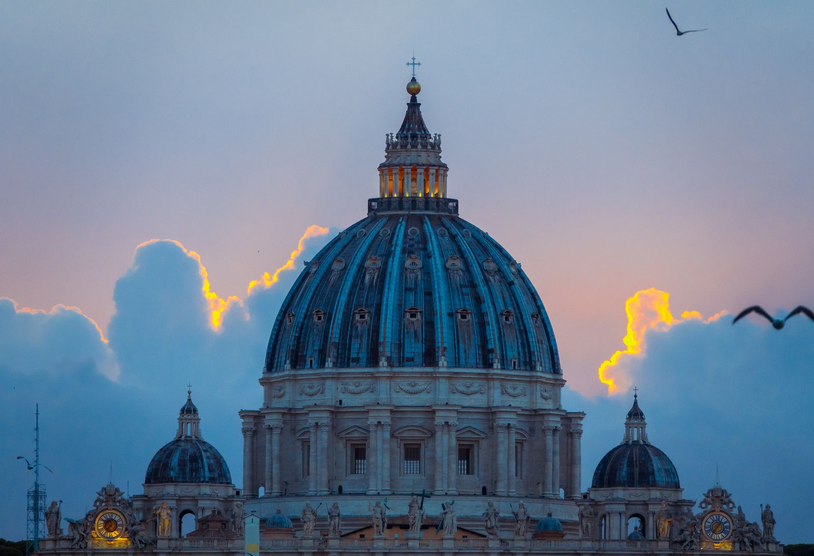 The dome of St Peter's Basilica at sunset over Vatican City, Rome