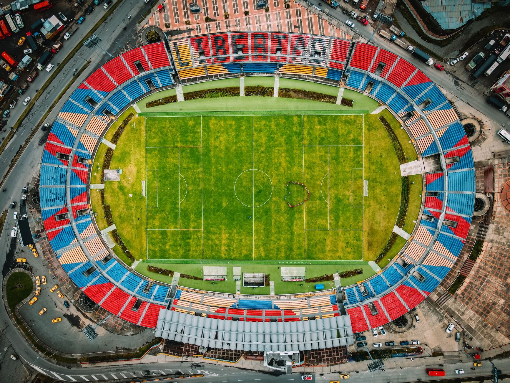 packed Estadio Azteca stands glowing under evening lights before a World Cup football match