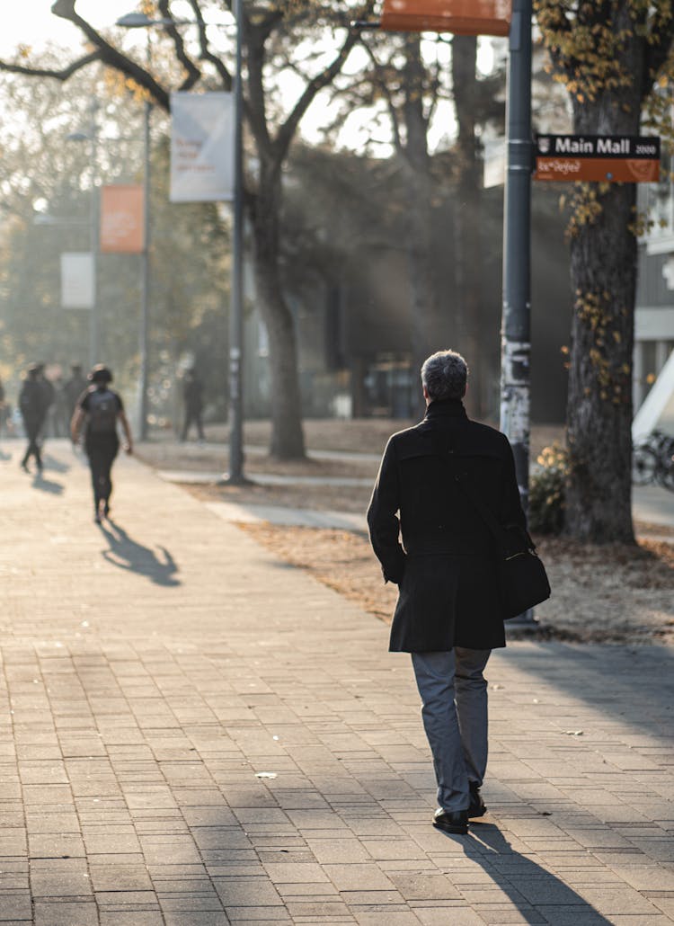 People Walking On Sidewalk