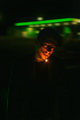 Cinematic night portrait under green light, photo by Vladislav Nahorny on Pexels
