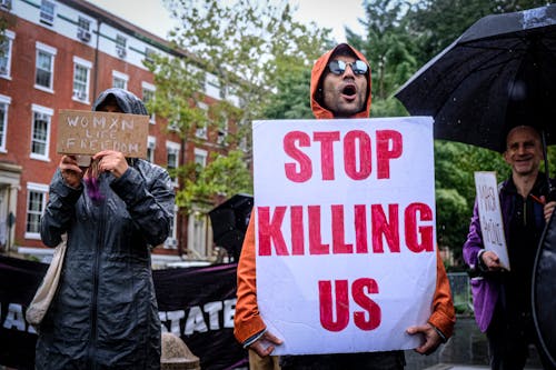 Demonstrators with Banners in the Rain 