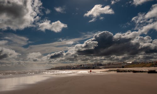 Photo of Beach under Cloudy Sky