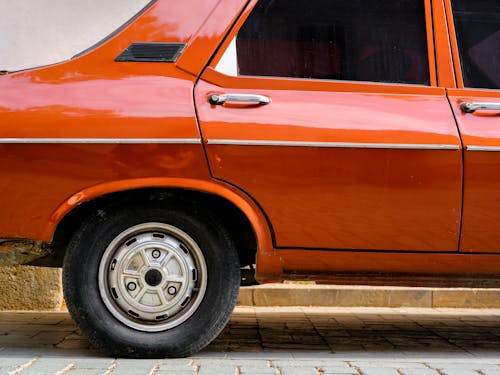 Close-Up Shot of Orange Car 