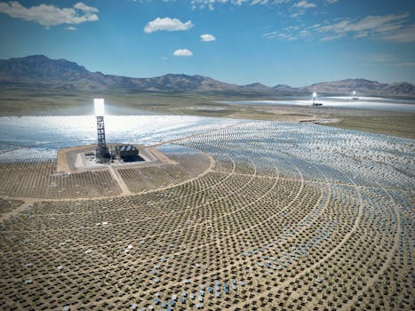 Stunning aerial view of the Ivanpah Solar Electric Generating System with mountainous backdrop.