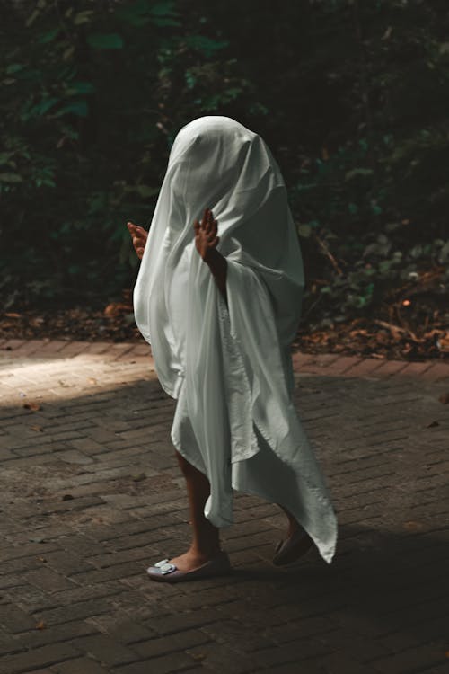 Woman in Bizarre Costume of Ghost