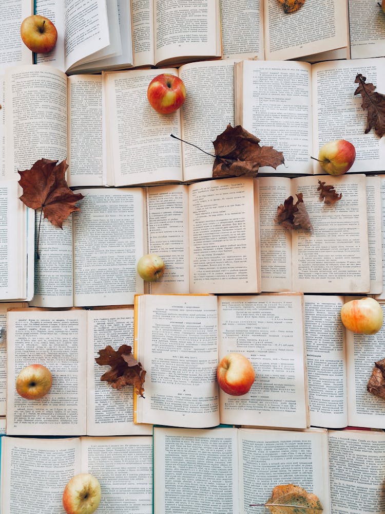 Apples And Leaves On Books