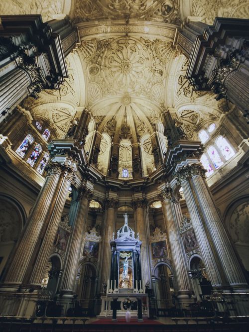 Free Stunning view of Malaga cathedral's altar, showcasing its Renaissance architecture and intricate ceiling design. Stock Photo