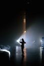 Silhouette of a Person Inside a Dark Room