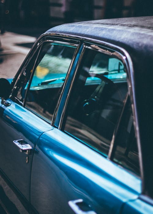 Close-up Photo of Blue Sedan