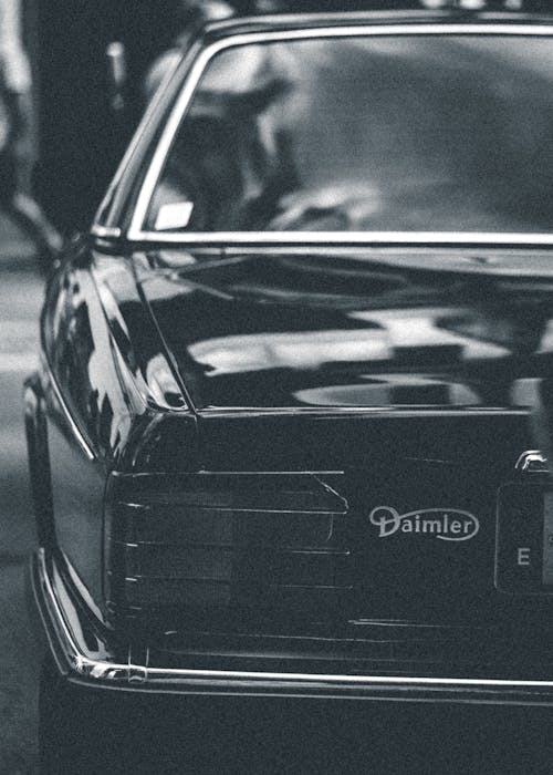 Grayscale Photo of Daimler Car