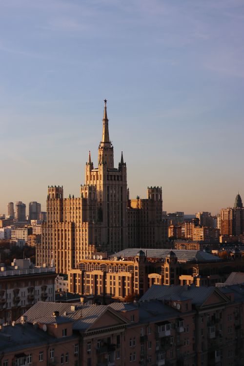 Free Aerial shot of Kudrinskaya Square building in Moscow during sunset with clear skies. Stock Photo