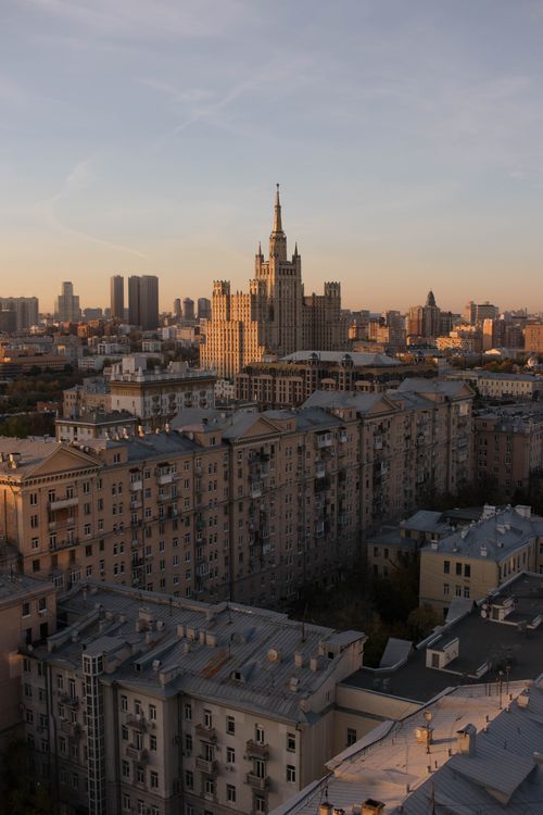 Free Aerial view of Moscow's skyline at sunset featuring historic architecture and skyscrapers. Stock Photo