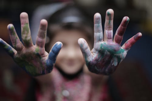 Close Up Photo of Hands with Paint