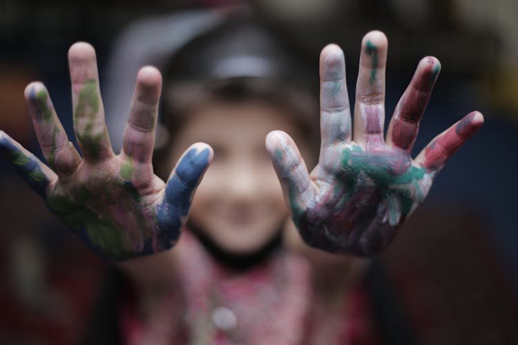 Close Up Photo Of Hands With Paint