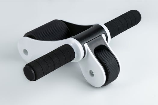 Close-up of a dual wheel ab roller with black handles on a white background, ideal for fitness routines.
