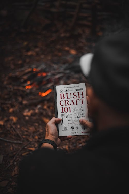 Bushcraft book by campfire