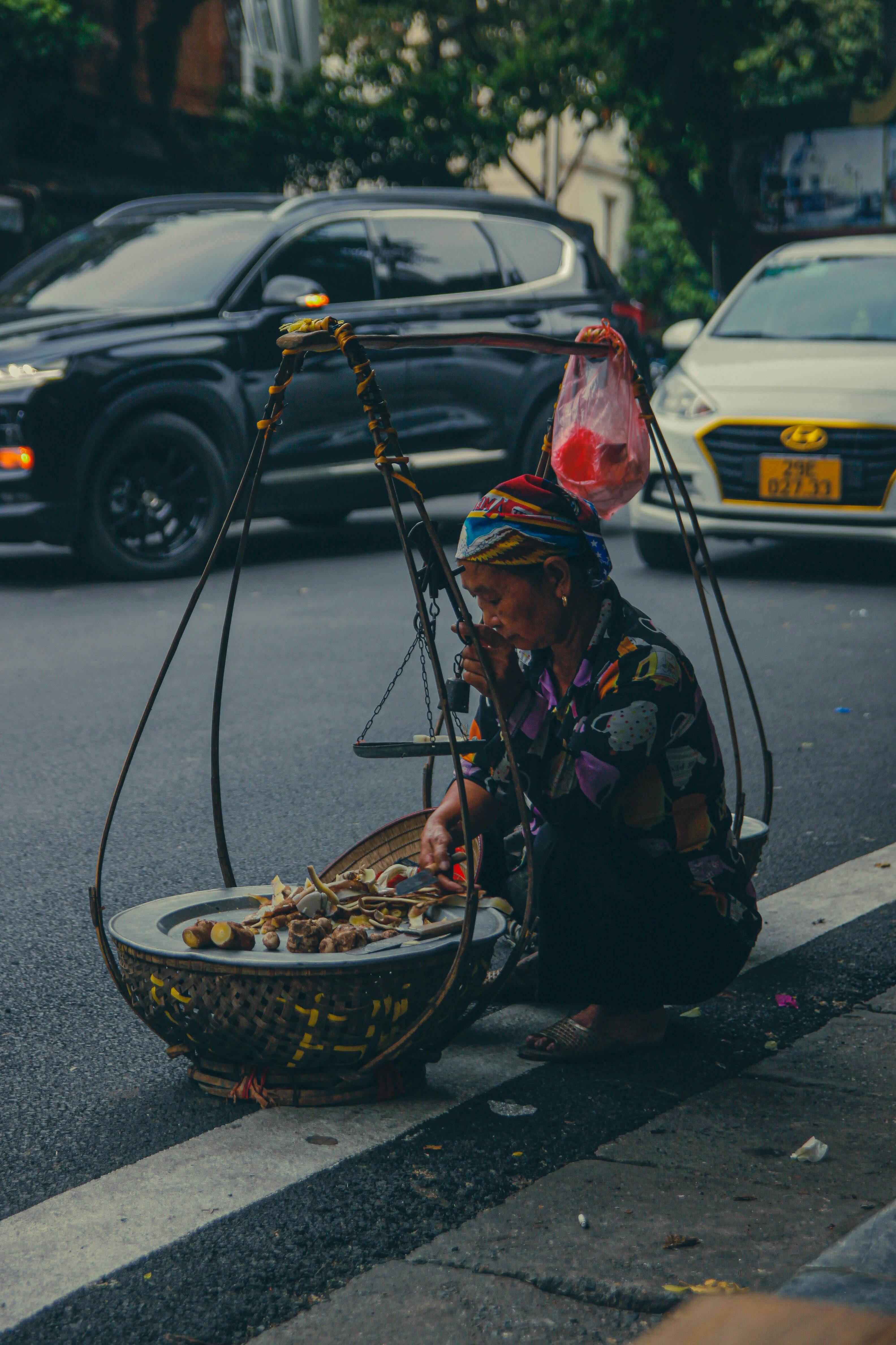 Woman with Large Scales on City Street · Free Stock Photo