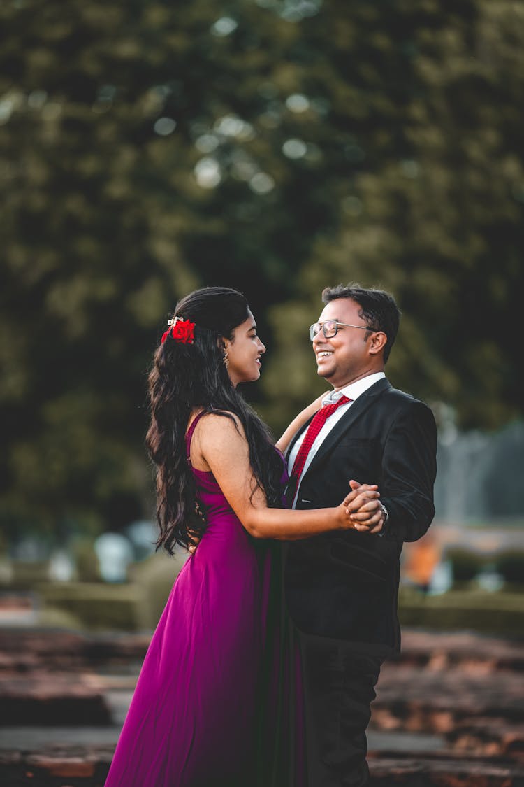 Man In Black Suit Dancing With A Woman