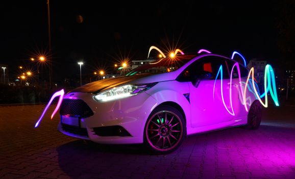 White Ford Fiesta ST Mk7 on a Parking Lot at Night