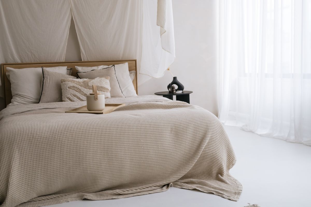 Calm coastal guest bedroom with neutral colors and natural decor