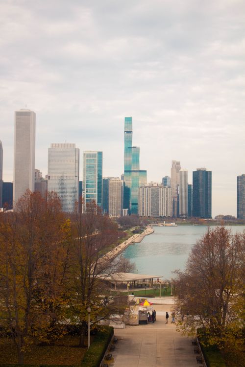 Free Captivating view of Chicago's skyline near the waterfront, showcasing fall colors and modern architecture. Stock Photo