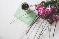 Bouquet of Pink Flowers Beside White Ceramic Mug
