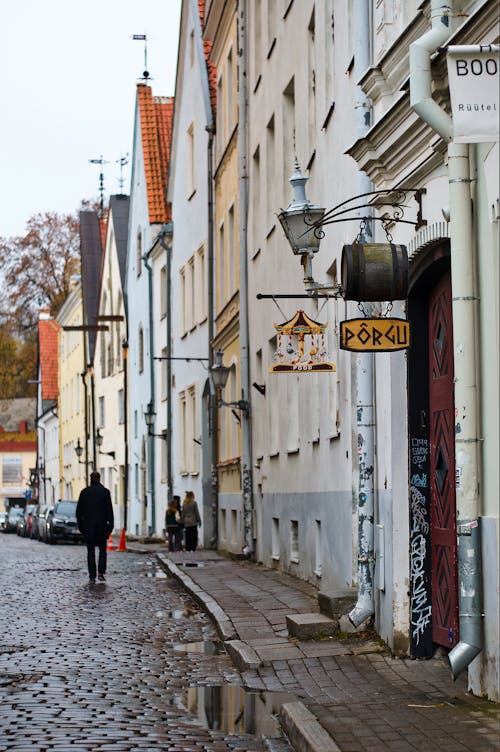 Ma Walking on Cobblestones Road