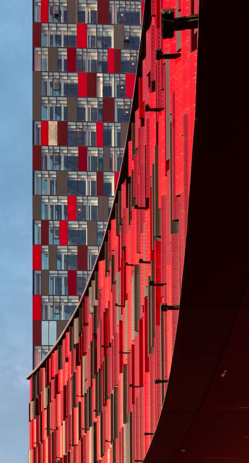 Free Stunning facade of the National Arena in vibrant red hues in Tirana, Albania. Stock Photo