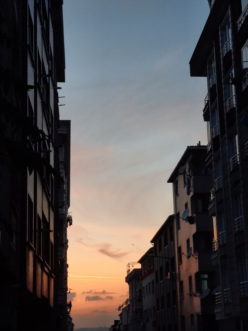 Free A stunning urban sunset view framed by tall İstanbul buildings. Stock Photo