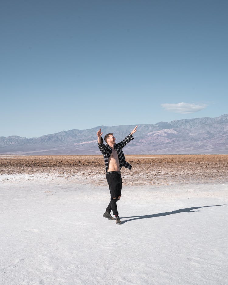 Man Walking In Death Valley Desert