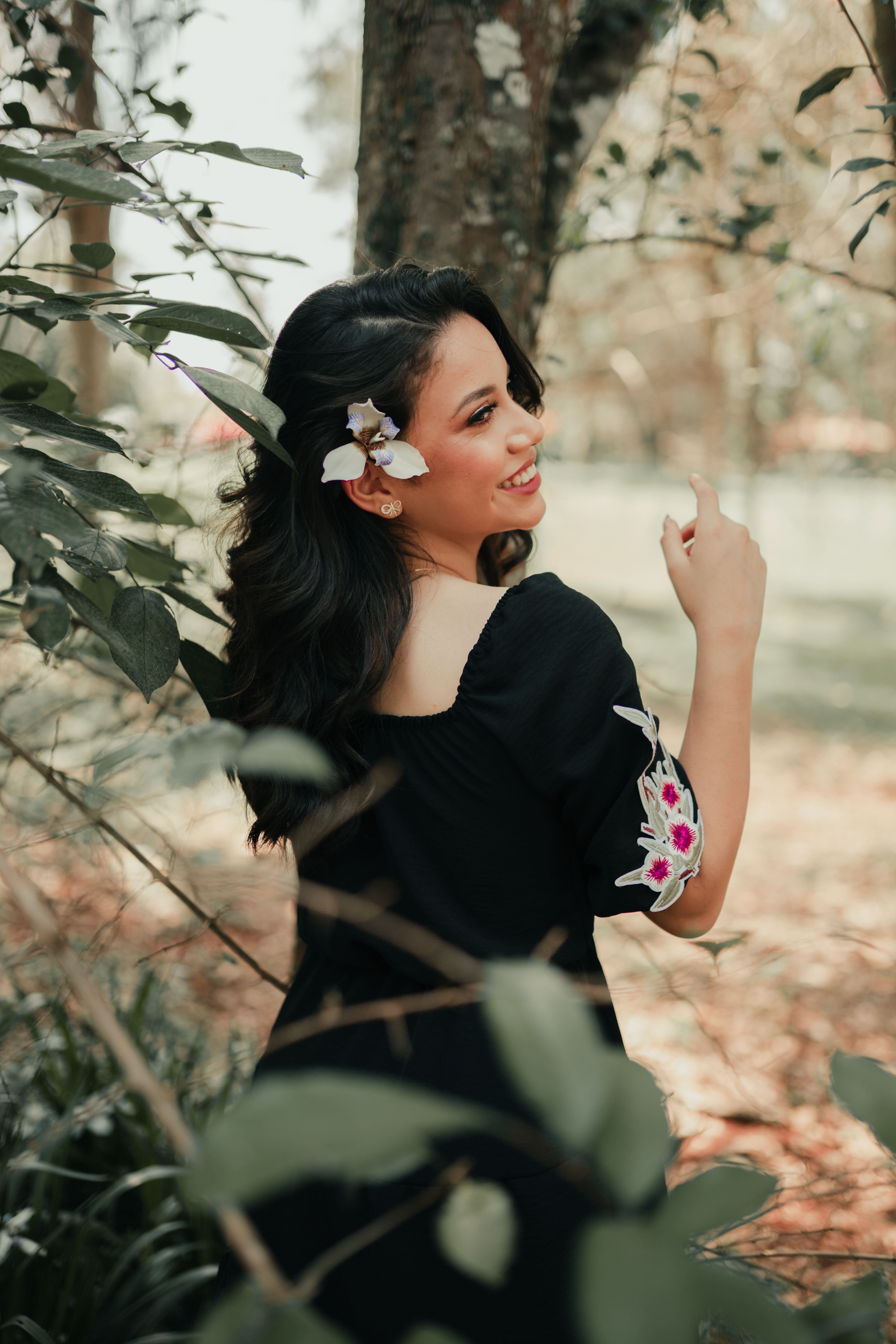 Photo of a Girl in a Black Dress with a Flower on Her Ear · Free Stock ...