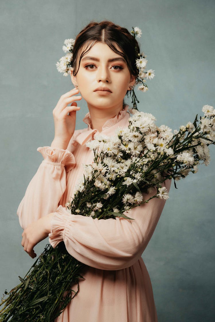 Portrait Of A Woman Holding Flowers