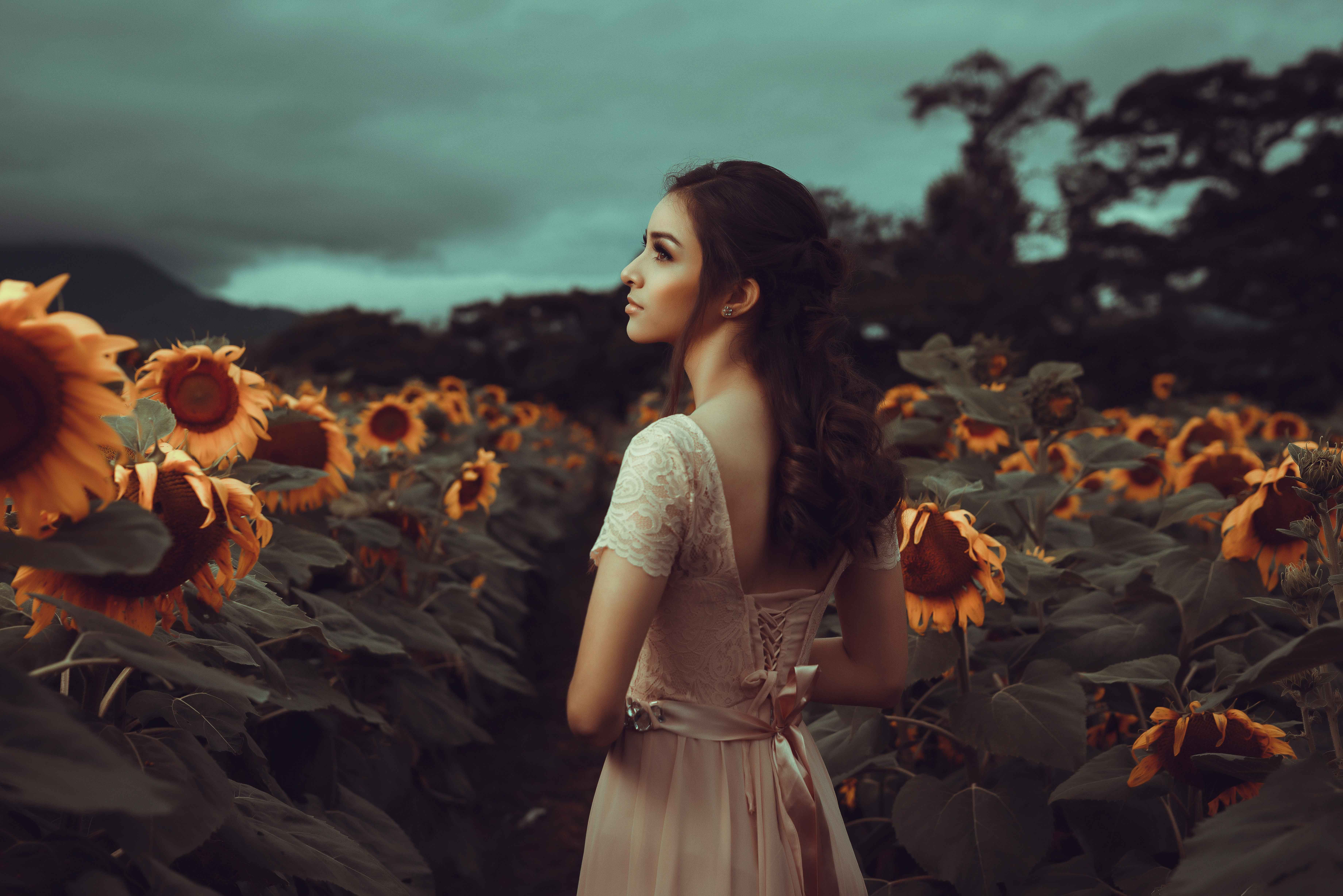 Woman Standing In Sunflower Field · Free Stock Photo