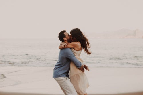 A Couple Hugging at the Beach